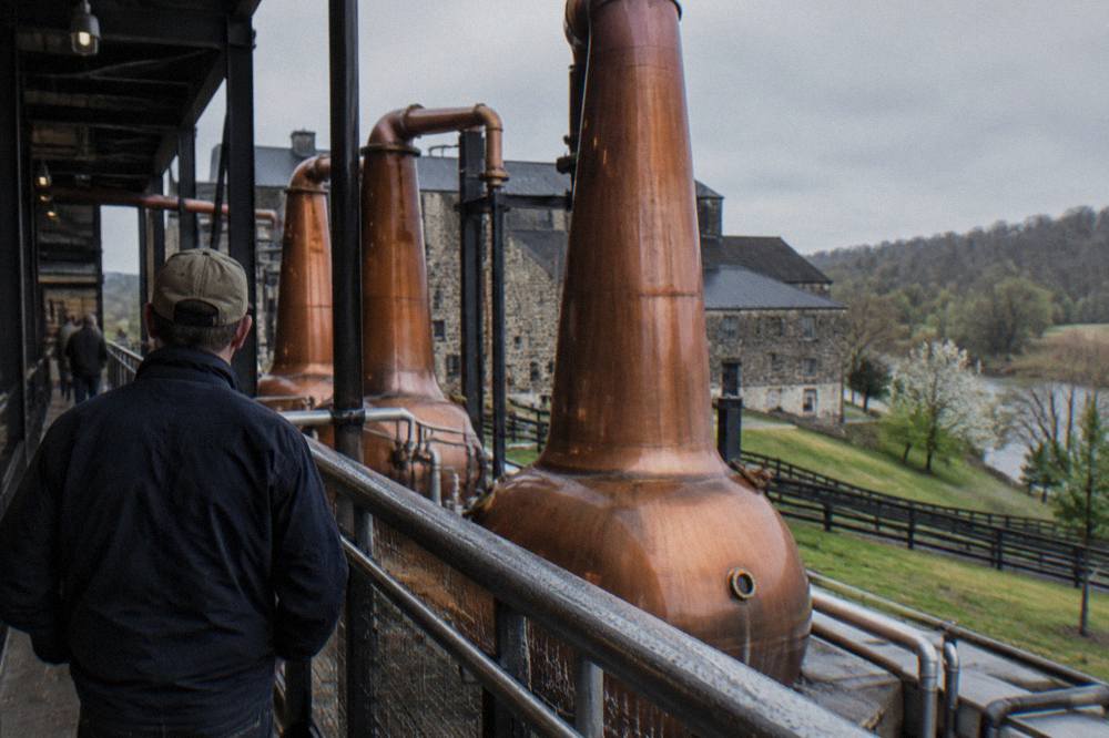 Copper pot stills inside a Kentucky distillery tour stop