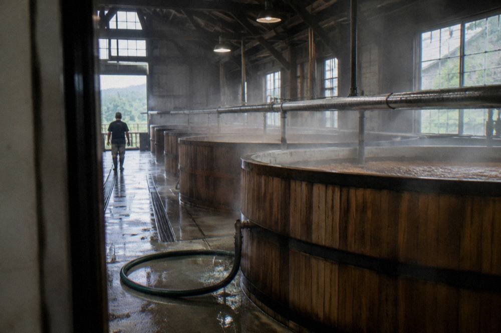 Copper fermentation tanks inside a working bourbon distillery in Kentucky