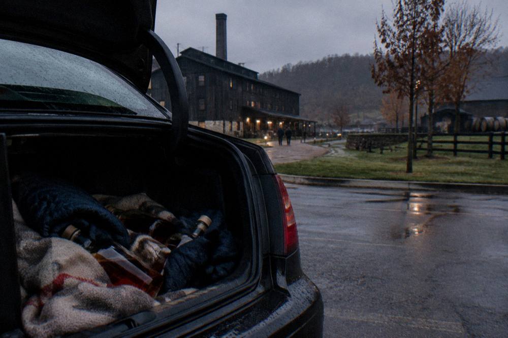 Bourbon bottles packed safely in a car trunk for the drive home from a distillery