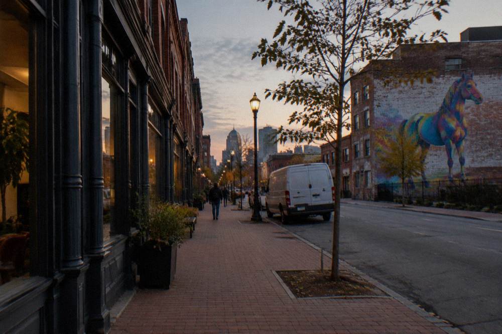 A historic brick whiskey district street with Victorian storefronts in Louisville